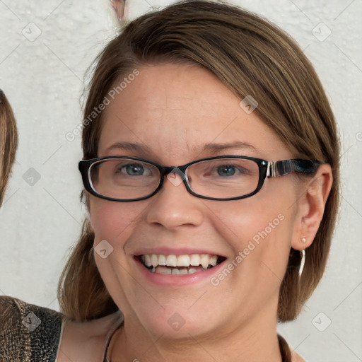 Joyful white adult female with medium  brown hair and blue eyes