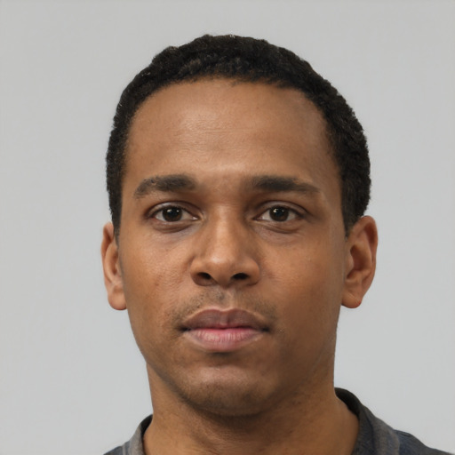 Neutral black young-adult male with short  black hair and brown eyes