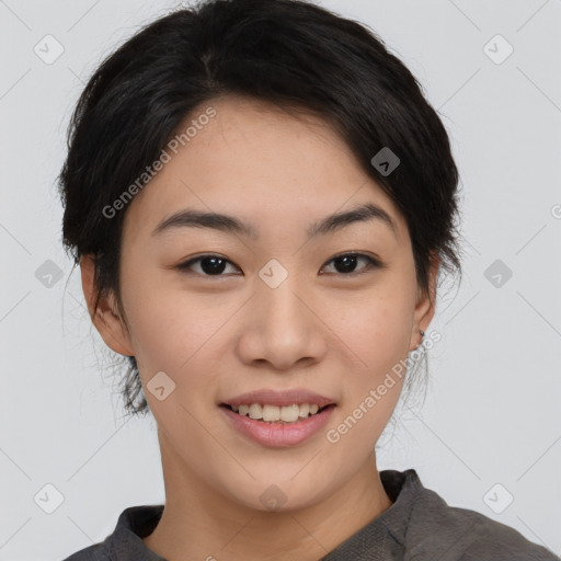 Joyful asian young-adult female with medium  black hair and brown eyes