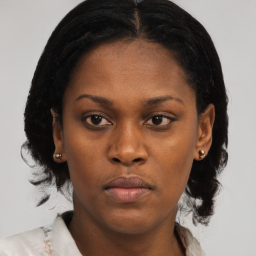 Neutral black young-adult female with medium  black hair and brown eyes