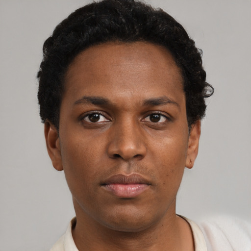 Neutral black young-adult male with short  black hair and brown eyes
