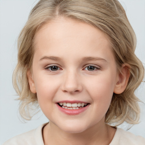 Joyful white child female with medium  blond hair and grey eyes