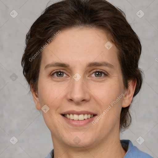 Joyful white adult female with medium  brown hair and grey eyes