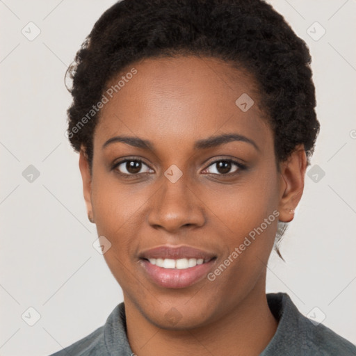 Joyful black young-adult female with short  brown hair and brown eyes