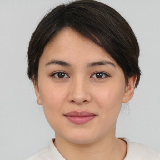 Joyful white young-adult female with medium  brown hair and brown eyes