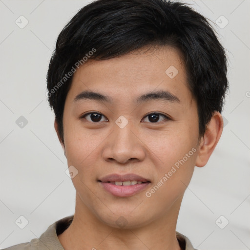 Joyful asian young-adult male with short  brown hair and brown eyes