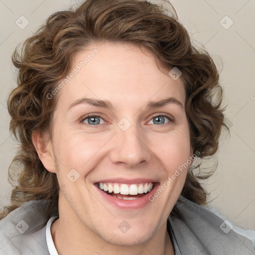 Joyful white young-adult female with medium  brown hair and blue eyes