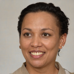 Joyful white adult female with short  brown hair and brown eyes