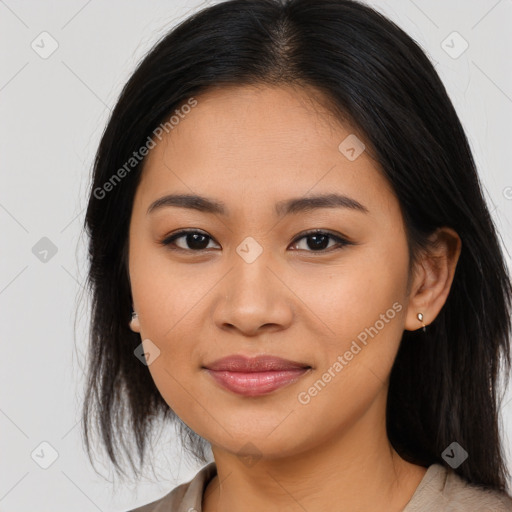 Joyful asian young-adult female with medium  brown hair and brown eyes