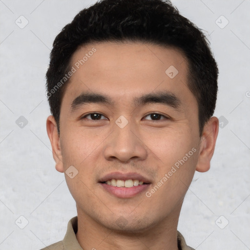 Joyful white young-adult male with short  black hair and brown eyes