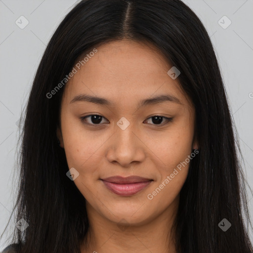 Joyful asian young-adult female with long  brown hair and brown eyes