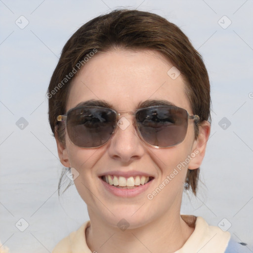 Joyful white young-adult female with medium  brown hair and blue eyes