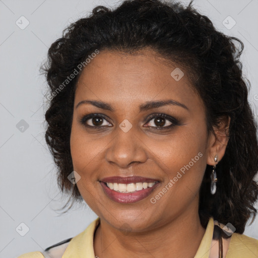 Joyful black young-adult female with medium  brown hair and brown eyes