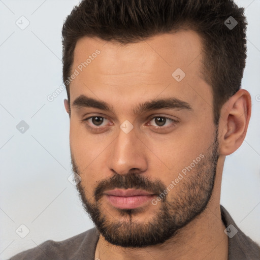 Neutral white young-adult male with short  brown hair and brown eyes