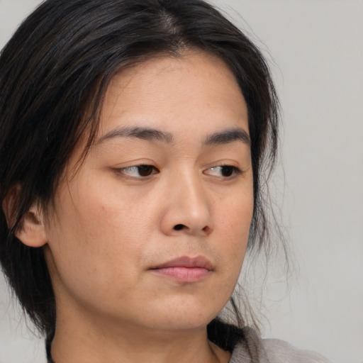 Neutral asian young-adult female with medium  brown hair and brown eyes