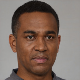 Neutral black young-adult male with short  black hair and brown eyes