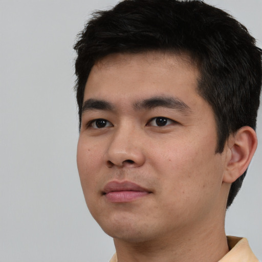 Neutral asian young-adult male with short  black hair and brown eyes