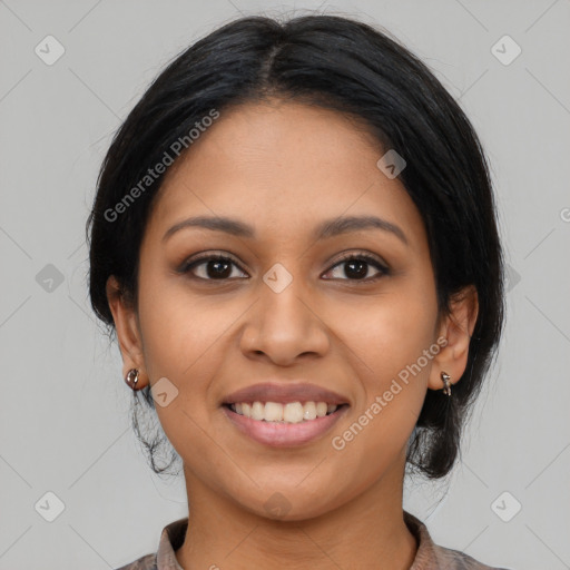 Joyful latino young-adult female with medium  black hair and brown eyes