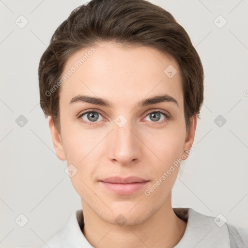 Joyful white young-adult female with short  brown hair and grey eyes