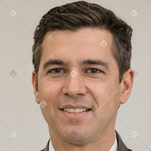 Joyful white adult male with short  brown hair and brown eyes