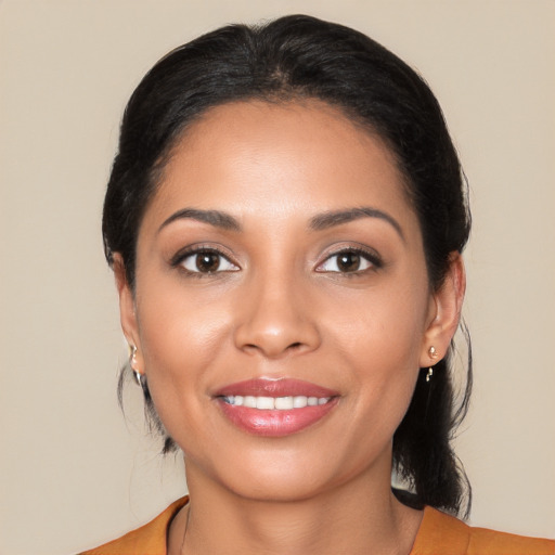 Joyful latino young-adult female with medium  black hair and brown eyes