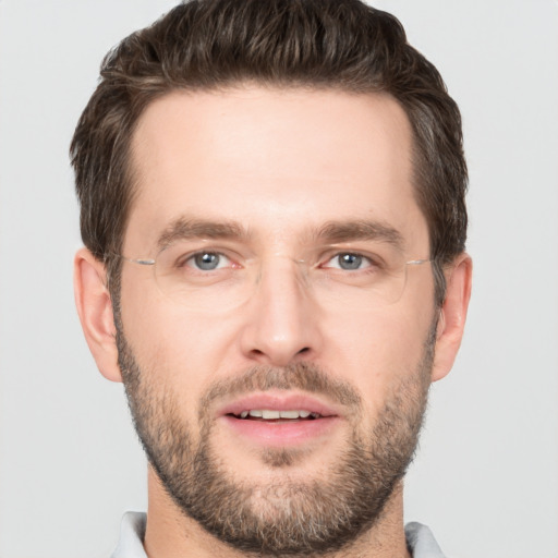 Joyful white young-adult male with short  brown hair and brown eyes