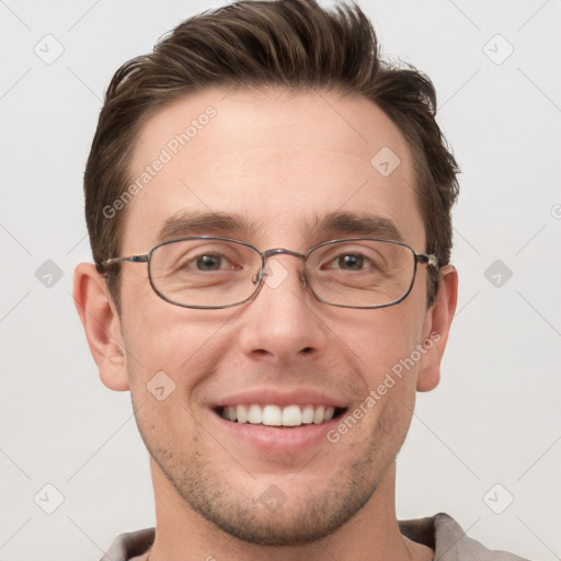 Joyful white adult male with short  brown hair and grey eyes