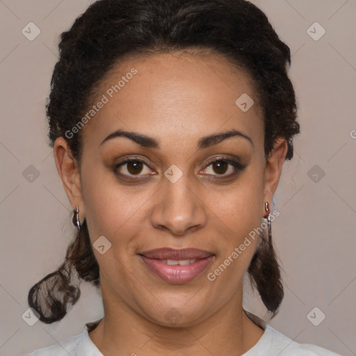 Joyful black adult female with medium  brown hair and brown eyes