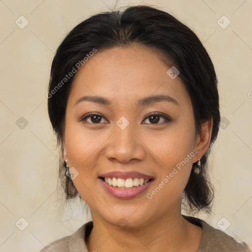 Joyful latino young-adult female with medium  brown hair and brown eyes