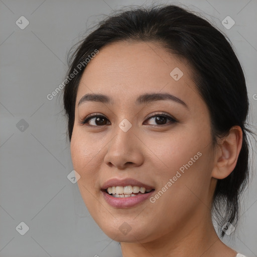 Joyful asian young-adult female with medium  brown hair and brown eyes