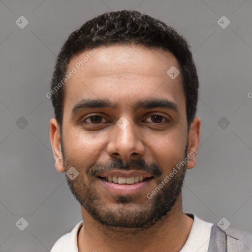 Joyful white young-adult male with short  black hair and brown eyes