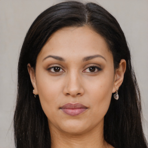 Joyful asian young-adult female with long  brown hair and brown eyes