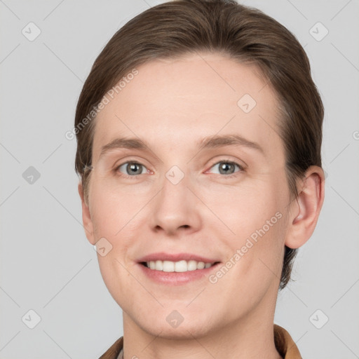 Joyful white young-adult female with short  brown hair and grey eyes