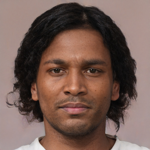 Neutral black young-adult male with short  brown hair and brown eyes