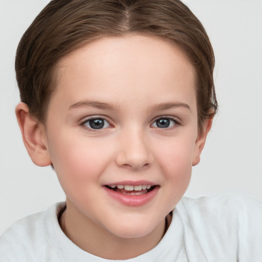 Joyful white child female with short  brown hair and brown eyes