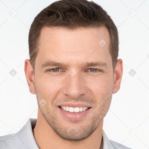 Joyful white young-adult male with short  brown hair and brown eyes