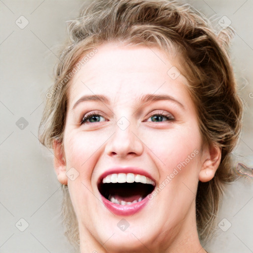 Joyful white young-adult female with medium  brown hair and blue eyes