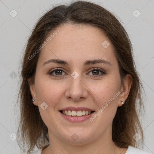 Joyful white young-adult female with medium  brown hair and grey eyes