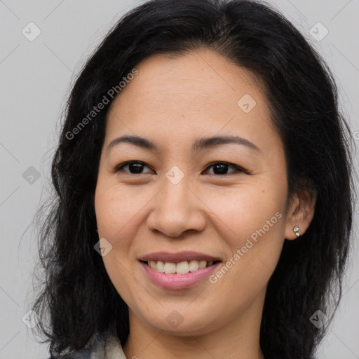 Joyful asian young-adult female with long  brown hair and brown eyes