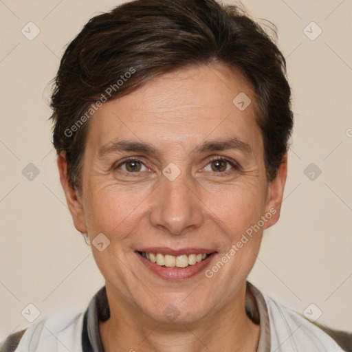 Joyful white adult female with short  brown hair and brown eyes