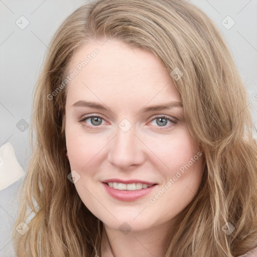 Joyful white young-adult female with long  brown hair and blue eyes