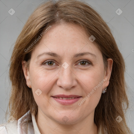 Joyful white adult female with long  brown hair and brown eyes