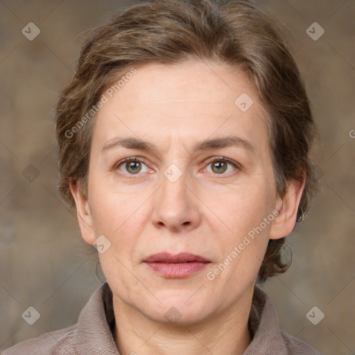 Joyful white adult female with medium  brown hair and grey eyes