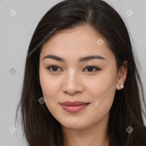 Joyful asian young-adult female with long  brown hair and brown eyes