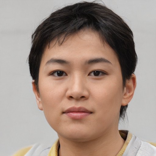Neutral asian young-adult female with short  brown hair and brown eyes