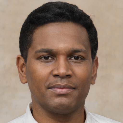 Neutral black young-adult male with short  black hair and brown eyes