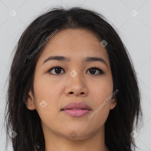 Joyful asian young-adult female with long  brown hair and brown eyes