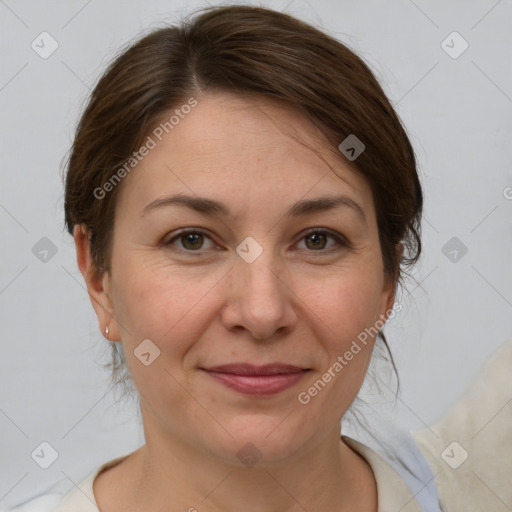 Joyful white adult female with medium  brown hair and grey eyes