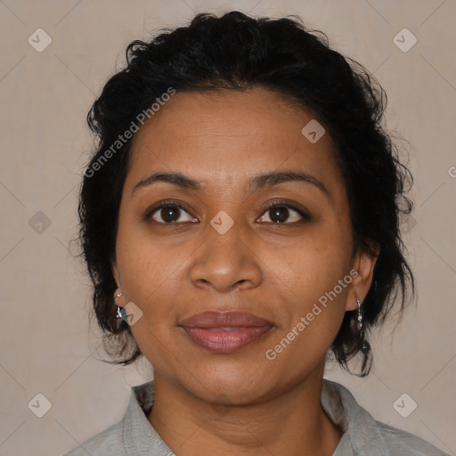 Joyful latino adult female with medium  brown hair and brown eyes