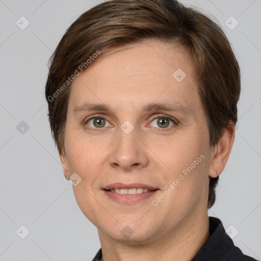 Joyful white adult female with short  brown hair and grey eyes